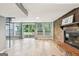 Inviting living room area with sliding doors leading to the backyard and a brick fireplace at 6072 Holiday Blvd, Forest Park, GA 30297