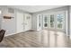 Bright living room with light gray walls, wood floors, and sunny bay window at 6072 Holiday Blvd, Forest Park, GA 30297