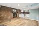 Open living area with brick fireplace and eat-in kitchen at 6072 Holiday Blvd, Forest Park, GA 30297