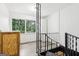 View of the house staircase with a side view of the outdoor landscape at 6072 Holiday Blvd, Forest Park, GA 30297