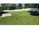 Expansive fenced backyard with lush green grass, offering privacy and ample space at 6120 Raleigh Oaks Ct, Lithonia, GA 30058