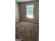 Bedroom with a window and carpeted floor at 6120 Raleigh Oaks Ct, Lithonia, GA 30058
