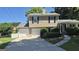 Inviting two-story home with a two-car garage, landscaped yard, and a classic design on a sunny day at 6120 Raleigh Oaks Ct, Lithonia, GA 30058