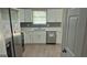 Well-lit kitchen featuring stainless steel appliances, modern countertops, and ample cabinet space, perfect for cooking at 6120 Raleigh Oaks Ct, Lithonia, GA 30058