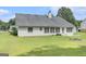 The home features a spacious backyard lawn and an expansive backyard patio at 1108 The By Way, Mcdonough, GA 30252