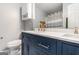 Elegant bathroom with dual sinks, navy blue cabinetry, and modern fixtures at 1108 The By Way, Mcdonough, GA 30252