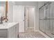 Modern bathroom featuring patterned floors, updated vanity, and glass-enclosed shower at 1108 The By Way, Mcdonough, GA 30252