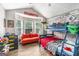 ' room featuring a bunk bed, vibrant sofa, wood flooring, and bright natural light at 1108 The By Way, Mcdonough, GA 30252
