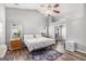 Bright bedroom features vaulted ceiling, wood-look floors, ceiling fan, and view to a secondary room at 1108 The By Way, Mcdonough, GA 30252