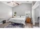 Serene bedroom with vaulted ceilings, wood floors, and natural light offers a peaceful retreat at 1108 The By Way, Mcdonough, GA 30252