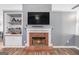 Cozy fireplace with built-in shelving in a well-lit living area at 1108 The By Way, Mcdonough, GA 30252