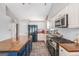 Spacious kitchen with stainless appliances, subway tile backsplash, large island, and plenty of cabinet space at 1108 The By Way, Mcdonough, GA 30252