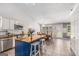 Kitchen featuring a central island, white cabinets, stainless steel appliances, and an adjacent dining area at 1108 The By Way, Mcdonough, GA 30252