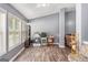 Versatile office space with natural light, neutral walls, and wood-look floors offers a functional work area at 1108 The By Way, Mcdonough, GA 30252