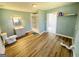 Spacious bathroom with a single vanity, walk-in shower and modern wood-look flooring at 36 Reese St, Grantville, GA 30220