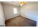 Comfortable bedroom featuring painted paneling, neutral carpet, and a standard window at 36 Reese St, Grantville, GA 30220