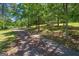 Long driveway lined with trees leading to the house at 416 S Carroll Rd, Villa Rica, GA 30180