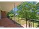 This home features a brick porch with iron railings, offering an inviting outdoor space to relax and enjoy the surroundings at 416 S Carroll Rd, Villa Rica, GA 30180