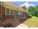 This home features a brick porch with iron railings, offering an inviting outdoor space to relax and enjoy the surroundings at 416 S Carroll Rd, Villa Rica, GA 30180