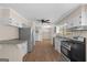 Charming kitchen with modern appliances and adjacent breakfast bar perfect for entertaining at 416 S Carroll Rd, Villa Rica, GA 30180