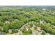 Neighborhood view of a lovely community nestled among mature trees and lush landscaping at 750 Highview Ct, Woodstock, GA 30189