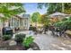 Backyard patio area with outdoor seating, a fire pit, and lush landscaping for relaxation and entertaining at 750 Highview Ct, Woodstock, GA 30189
