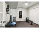 Basement gym with black rubber flooring, ceiling fan, and fitness equipment for at-home workouts at 750 Highview Ct, Woodstock, GA 30189