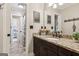 Bathroom featuring a granite countertop vanity, tile floors, and bronze fixtures at 750 Highview Ct, Woodstock, GA 30189