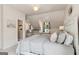 Comfortable bedroom with dormer windows, window seats, and stylish decor at 750 Highview Ct, Woodstock, GA 30189