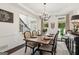 Dining room with hardwood flooring, chandelier, and a view to the entry of the house at 750 Highview Ct, Woodstock, GA 30189