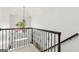 Elegant foyer showcasing wrought iron railing and chandelier at 750 Highview Ct, Woodstock, GA 30189
