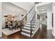 Bright foyer showcases elegant staircase and flows into the dining room, creating a welcoming ambiance at 750 Highview Ct, Woodstock, GA 30189