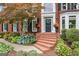 Close up of brick home with flowers and greenery surrounding entry at 750 Highview Ct, Woodstock, GA 30189