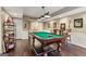 Finished basement game room with hardwood floors, a pool table, and wainscoting at 750 Highview Ct, Woodstock, GA 30189