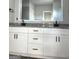 Bathroom featuring granite countertops and white cabinetry with double sinks at 1705 Lake Dow Rd, Mcdonough, GA 30252