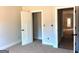 Bedroom interior with open doors showcasing the closet and hallway entrance at 1705 Lake Dow Rd, Mcdonough, GA 30252