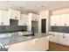 Kitchen with island sink, granite countertops, white cabinetry, and stainless steel appliances at 1705 Lake Dow Rd, Mcdonough, GA 30252