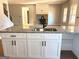 Kitchen with island sink, granite countertops, white cabinetry, and stainless steel appliances at 1705 Lake Dow Rd, Mcdonough, GA 30252