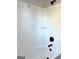 Shower-tub featuring white tile surround and black hardware at 1705 Lake Dow Rd, Mcdonough, GA 30252