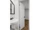 Bathroom featuring pedestal sink and view into bedroom at 5180 Ash St, Forest Park, GA 30297
