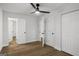 Bedroom featuring wood flooring, closet space, and ensuite bathroom at 5180 Ash St, Forest Park, GA 30297