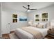 Bedroom with windows, ceiling fan, and side tables at 5180 Ash St, Forest Park, GA 30297