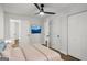 Bedroom features a closet, ensuite bathroom, and wood flooring at 5180 Ash St, Forest Park, GA 30297