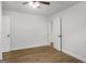 Bedroom with laminate flooring, simple decor, and a ceiling fan at 5180 Ash St, Forest Park, GA 30297