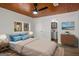 Bright bedroom with wood ceiling, ceiling fan and ensuite bathroom at 5180 Ash St, Forest Park, GA 30297