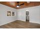 Bright bedroom with a wood ceiling, fan and wood flooring at 5180 Ash St, Forest Park, GA 30297