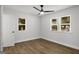 Bedroom with wood flooring, ceiling fan, and natural light at 5180 Ash St, Forest Park, GA 30297