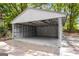 Open garage for parking, storage, or workshop space at 5180 Ash St, Forest Park, GA 30297