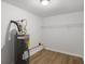 Utility room features a water heater and shelving at 5180 Ash St, Forest Park, GA 30297