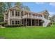 Large home featuring a dual-level deck and ample backyard space at 115 Edgewood Pkwy, Fayetteville, GA 30215